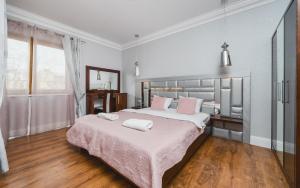 מיטה או מיטות בחדר ב-MB Cracow Apartments
