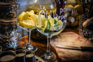 two wine glasses filled with lemons on a table at The Dark Horse in Bristol