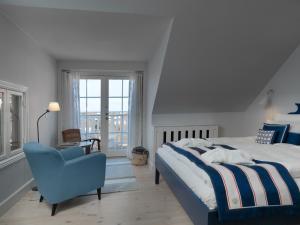 Postel nebo postele na pokoji v ubytování Strandhotellet