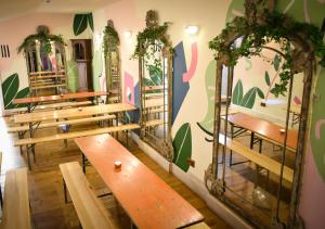 a row of wooden benches in a room at The Dark Horse Pub in Bristol