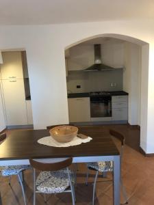 a kitchen with a table with a bowl on it at La Finestra sul mare in La Spezia
