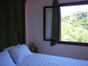 Posteľ alebo postele v izbe v ubytovaní Oliaria Apartments