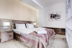 Postel nebo postele na pokoji v ubytování Riva Residence