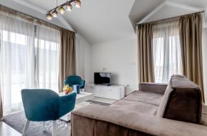 TV a/nebo společenská místnost v ubytování Riva Residence