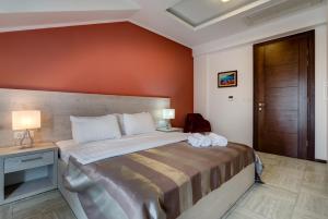 Postel nebo postele na pokoji v ubytování Riva Residence