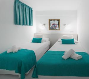 Postel nebo postele na pokoji v ubytování BC Music Resort
