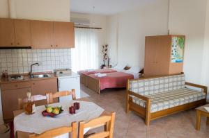Postel nebo postele na pokoji v ubytování Dimitriou Rooms