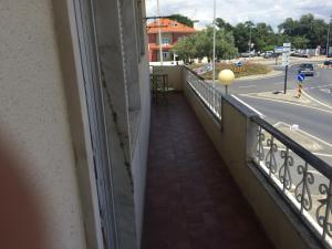 a balcony of a building with a view of a street at Yard in Amora