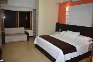 Postel nebo postele na pokoji v ubytování Hotel La Laguna Galapagos