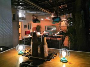 a table with two bottles and two lights on it at Meraki Boutique Hotel in Guatemala +26 photos