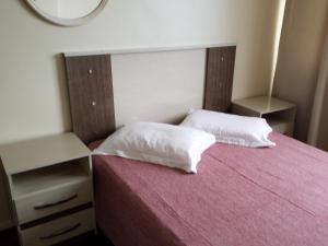 Cama o camas de una habitación en Camburiu Apartamento Frente al Mar
