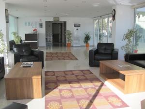 TV a/nebo společenská místnost v ubytování Olbia Residence Hotel