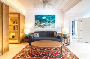 a living room with a couch and a table at Columbia Beach Resort in Pissouri