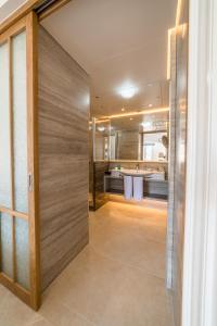 a pivot door in a room with a bathroom at Columbia Beach Resort in Pissouri