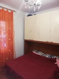 Łóżko lub łóżka w pokoju w obiekcie Ortensia - Sanremo Apartments