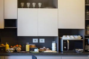 A kitchen or kitchenette at Top Floor Trastevere
