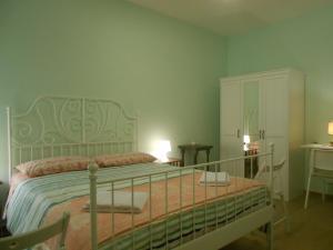 Кровать или кровати в номере L'Oleandro di Alfredo