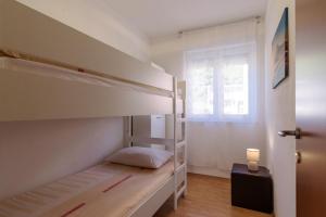 Posteľ alebo postele v izbe v ubytovaní Apartman Niko