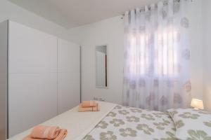 Posteľ alebo postele v izbe v ubytovaní Apartman Niko