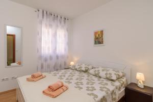 Posteľ alebo postele v izbe v ubytovaní Apartman Niko