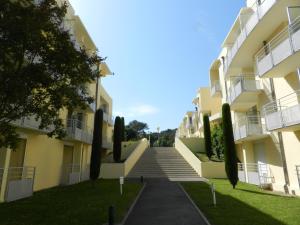 a stairway leading to the side of a building at City Résidence Sophia in Valbonne