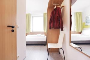 Letto o letti in una camera di bp24 Hotel Aachen