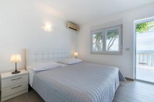 Apartments Zanic on The Beach客房内的一张或多张床位
