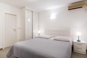 Apartments Zanic on The Beach客房内的一张或多张床位