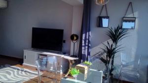 TV a/nebo společenská místnost v ubytování Apartamento "SOLAZ"