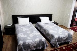 Postel nebo postele na pokoji v ubytování Hotel Zarafshon in Dushanbe
