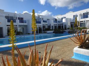 a view of the exterior of a hotel with a swimming pool at BLU in Puerto del Carmen