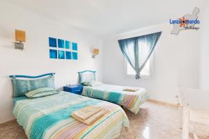 Postel nebo postele na pokoji v ubytování Vivienda Vacacional Sunny - duplex apartment 2beds 2 baths