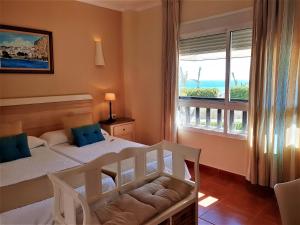 Кровать или кровати в номере Hotel las Calas