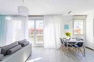 a living room with a couch and a table at Dream park in Montévrain