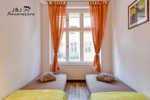 J&J Apartments Łazienna 30 - 10客房内的一张或多张床位