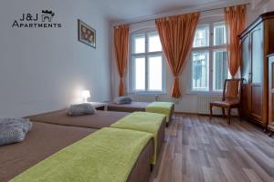 J&J Apartments Łazienna 30 - 10客房内的一张或多张床位
