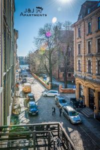 a view of a street with cars parked on the road at J&J Apartments Łazienna 30 Pensjonat 10 in Toruń