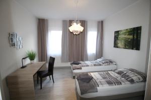 Katil atau katil-katil dalam bilik di Aussicht Mainz-City - 4 Zimmer-max 7 Personen