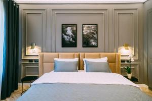 Postel nebo postele na pokoji v ubytování Hotel Stela Center