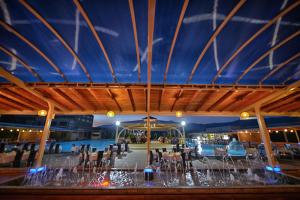 a view of a restaurant with a blue ceiling at Hotel New Star in Skopje +61 photos