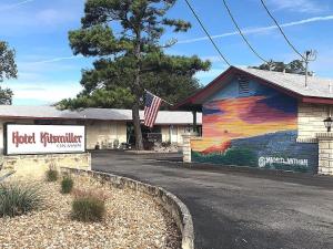 a building with a colorful mural on the side of it at Hotel Kitsmiller on Main in Fredericksburg