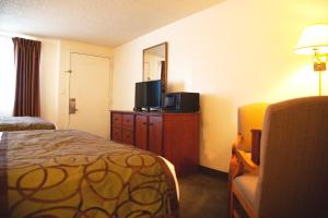 a hotel room with a bed and a television at Bryce View Lodge Part of the Ruby's Inn Resort in Bryce Canyon