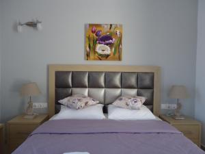 Postel nebo postele na pokoji v ubytování Rita's Place Hotel
