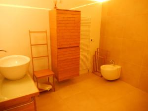 a bathroom with a sink and a toilet at Apartment Amsterdam New West - Free parking in Amsterdam +13 photos