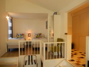 a small room with two beds and a table at Apartment Amsterdam New West - Free parking in Amsterdam