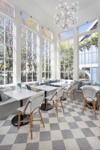 a large room with a table and chairs in it at Hideaway Santa Barbara, A Kirkwood Collection Property in Santa Barbara