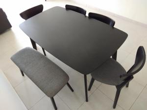 a black table with two chairs and a black table at Cameron Cactus Apartment @ Pangsapuri Kaktus in Brinchang