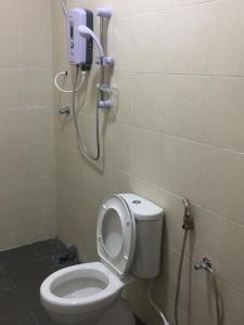 a bathroom with a toilet and a shower in it at Cameron Cactus Apartment @ Pangsapuri Kaktus in Brinchang