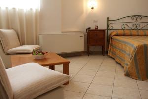 A bed or beds in a room at Hotel I Platani