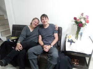 a man and a woman sitting in a chair at Catari's House in Machu Picchu